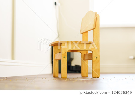 New creative small chair for kids made of solid ash and walnut tree on a white background. Wooden furniture 124036349