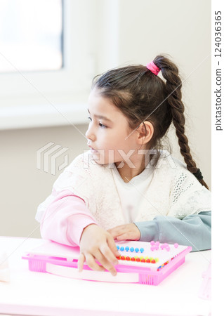 girl plays educational games, 124036365