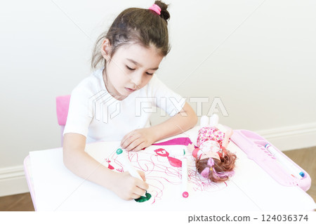 Cute little preschooler child drawing at home Cute little preschooler child drawing at home 124036374