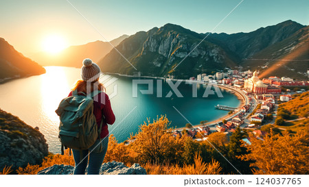A lone tourist woman wanders across the rugged, rocky terrain, embracing the solitude and beauty of the vast landscape. The concept of adventure, self-discovery, and the spirit of exploration. 124037765