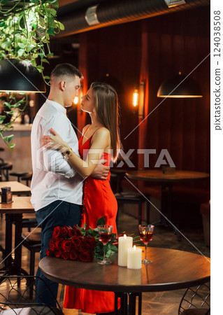 Closeness of the people. Romantic couple have dinner in the restaurant Closeness of the people. Romantic couple have dinner in the restaurant 124038508