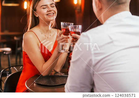 Talking with each other. Romantic couple have dinner in the restaurant 124038571