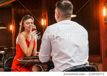 Talking with each other. Romantic couple have dinner in the restaurant Talking with each other. Romantic couple have dinner in the restaurant 124038572