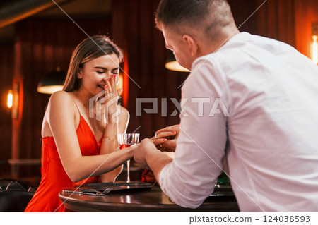 Making marriage proposal. Romantic couple have dinner in the restaurant 124038593