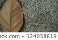 Brown leaves on concrete floor 124038819