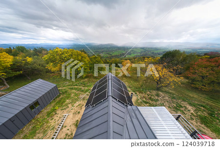 New modern house cottage with solar photovoltaic panel system on roof. Aerial view. Concept of alternative, renewable energy and home autonomy. 124039718