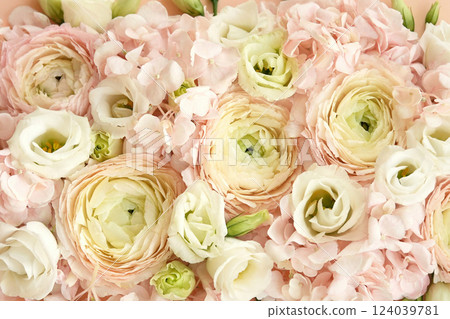 Summer blossoming delicate ranunculus on blooming flowers festive background, pastel and soft bouquet floral card, selective focus, shallow DOF 124039781