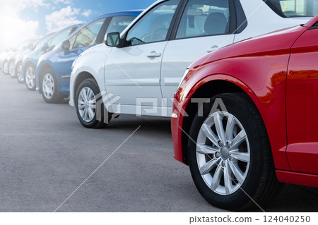 A lot of cars in a rows. Used car sales 124040250