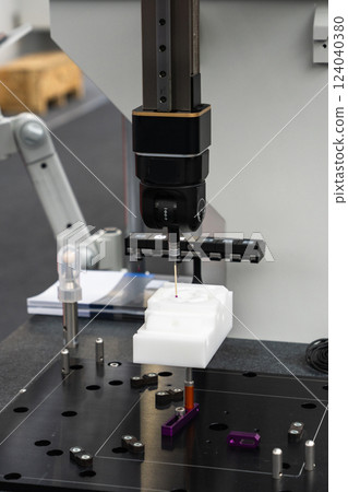 Infrared sensor for measuring parts. Quality evaluation on a modern factory. Infrared sensor for measuring parts. Quality evaluation on a modern factory. 124040380