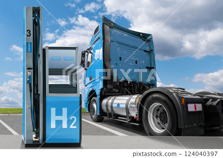Man holds a hydrogen fueling nozzle on a hydrogen filling station. Refueling car with hydrogen fuel 124040397