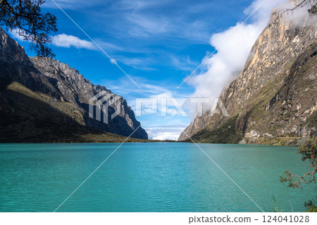Turquoise lake surrounded by mountains on the Laguna 69 trek, Peru 124041028