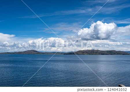 View of Lake Titicaca from Llachon with distant islands and hills View of Lake Titicaca from Llachon with distant islands and hills 124041032