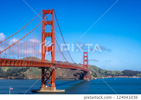 Golden Gate Bridge over blue waters with scenic hills in San Francisco Golden Gate Bridge over blue waters with scenic hills in San Francisco 124041036
