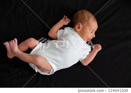 Newborn Baby on Black Background Newborn Baby on Black Background 124041209