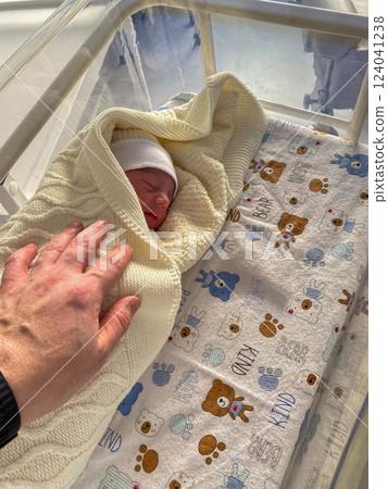 Newborn Baby in Hospital Bassinet with Bear Sheet 124041238