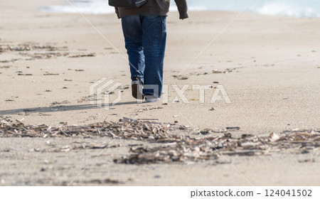 Walking on a sandy beach 124041502