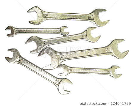 A collection of shiny metal wrenches scattered on a white background. This image conveys concepts of repair, maintenance, DIY, and problemsolving. A collection of shiny metal wrenches scattered on a white background. This image conveys concepts of repair, maintenance, DIY, and problemsolving. 124041739