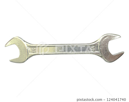 A single, metallic wrench rests on a stark white background. A single, metallic wrench rests on a stark white background. 124041740
