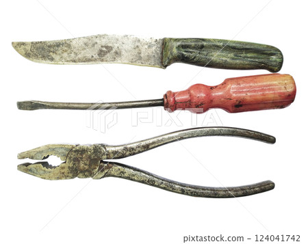 Aged tools a knife, screwdriver, and pliers, arranged on a white background. Evokes nostalgia, DIY, and craftsmanship. Perfect for projects about repair, vintage items, or manual labor. Aged tools a knife, screwdriver, and pliers, arranged on a white background. Evokes nostalgia, DIY, and craftsmanship. Perfect for projects about repair, vintage items, or manual labor. 124041742