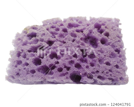 Closeup of a used purple cleaning sponge, showcasing its texture and porous structure.  A visual metaphor for hard work and resilience, ideal for cleaning, hygiene, or abstract concepts. 124041791