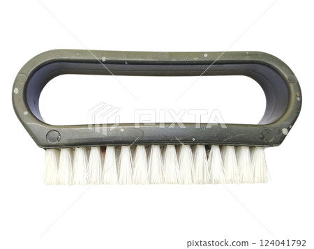 Closeup of a simple, handheld brush with a dark gray plastic handle and white bristles.  Perfect for illustrating cleaning, maintenance, or detailing concepts. 124041792