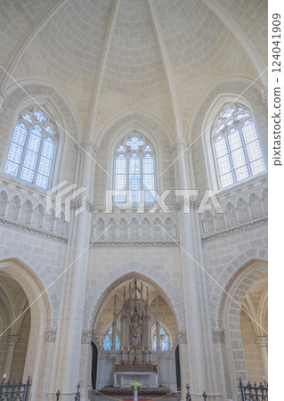 The striking interior of the Schwarzenberg Tomb features elegant architecture, large stained glass windows, and a central altar in Domanin, Czechia, creating a serene atmosphere. 124041909