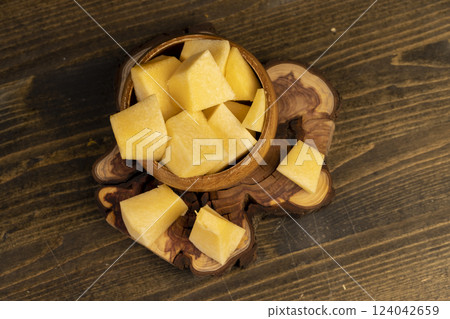pumpkin pulp in a wooden bowl on the table 124042659