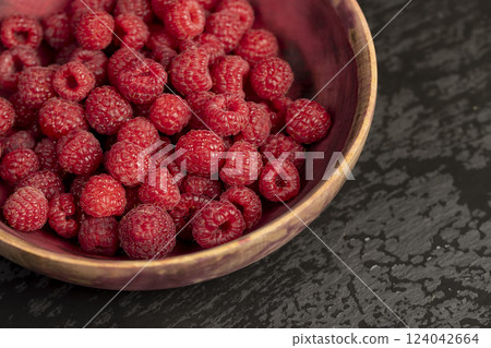 fresh red raspberries on the table fresh red raspberries on the table 124042664