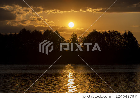 the lake with orange water in the summer at sunset 124042797