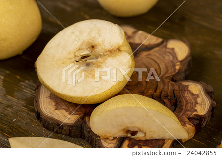 ripe white pear with a yellow colour on the table ripe white pear with a yellow colour on the table 124042855