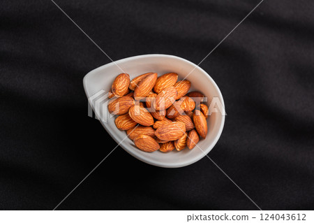 Almonds in a drop tray Almonds in a drop tray 124043612