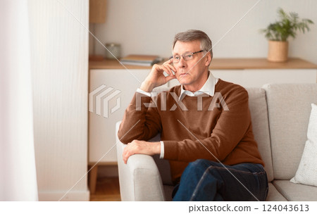Depression In Older Age. Sad Senior Man Thinking About Retirement Sitting On Couch At Home. Selective Focus, Copy Space Depression In Older Age. Sad Senior Man Thinking About Retirement Sitting On Couch At Home. Selective Focus, Copy Space 124043613
