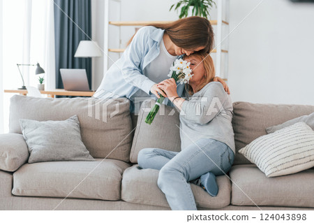 Happy mother's day. Senior woman and daughter is together at home 124043898