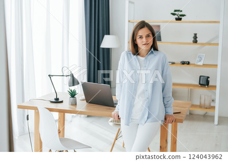 Young beautiful woman is home alone in domestic room Young beautiful woman is home alone in domestic room 124043962