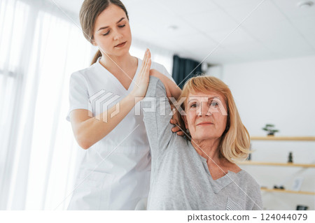 Senior woman is visiting physician in the office 124044079