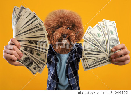 A fluffy dog in a playful outfit is joyfully holding large bundles of cash with both paws. The bright yellow background enhances the cheerful atmosphere, making it a lively and humorous display. A fluffy dog in a playful outfit is joyfully holding large bundles of cash with both paws. The bright yellow background enhances the cheerful atmosphere, making it a lively and humorous display. 124044102