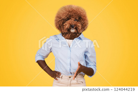 A humorous display features a dog with a fluffy brown head atop a person body, who stands confidently with one hand on their hip. The vibrant yellow backdrop enhances the playful vibe 124044219