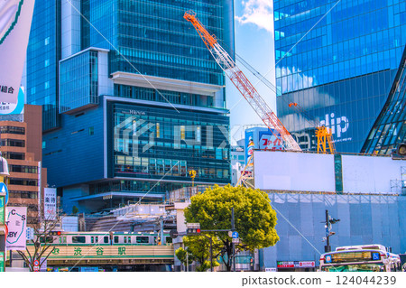 Tokyo cityscape in Japan. A crane facing left. Shibuya Station redevelopment... Hachiko ticket gate is already at the bottom of Miyamasuzaka = March 17th Tokyo cityscape in Japan. A crane facing left. Shibuya Station redevelopment... Hachiko ticket gate is already at the bottom of Miyamasuzaka = March 17th 124044239