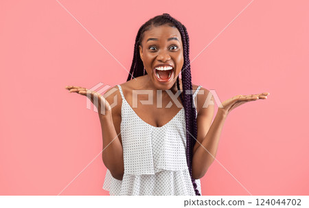 Portrait of young black woman feeling excited, shouting OMG or WOW, expressing emotion of joy on pink studio background. Unbelievable offer, shocking news, huge sale or discount 124044702