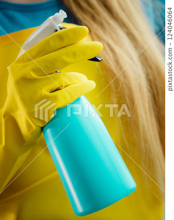 Hand cleaning window at home using detergent rag Hand cleaning window at home using detergent rag 124046064