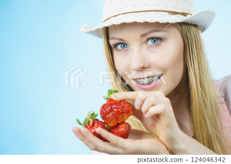 Young woman with fresh strawberries 124046342