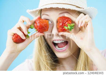 Young woman with fresh strawberries 124046343
