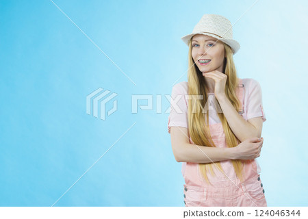 Happy woman wearing summer outfit 124046344