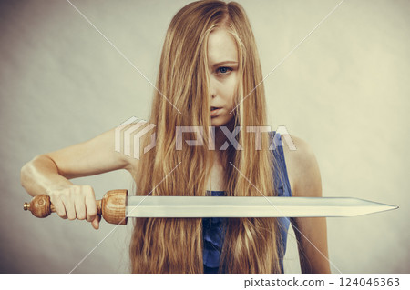 Girl with sword for haircutting 124046363