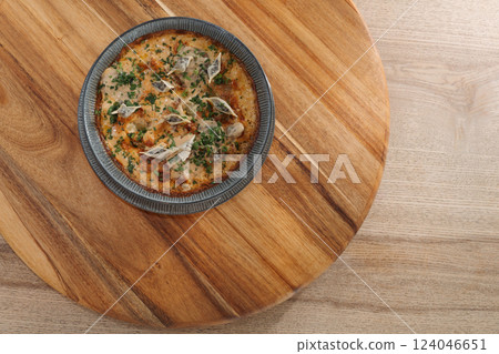 mushroom ravioli dish. Delicious freshly prepared meal, perfect for menus, restaurants, or food delivery concepts. mushroom ravioli dish. Delicious freshly prepared meal, perfect for menus, restaurants, or food delivery concepts. 124046651