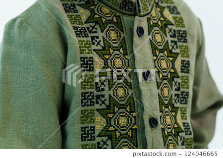 Close-up of Light Green Traditional Shirt with Intricate Ethnic Embroidery Pattern and Buttons Close-up of Light Green Traditional Shirt with Intricate Ethnic Embroidery Pattern and Buttons 124046665