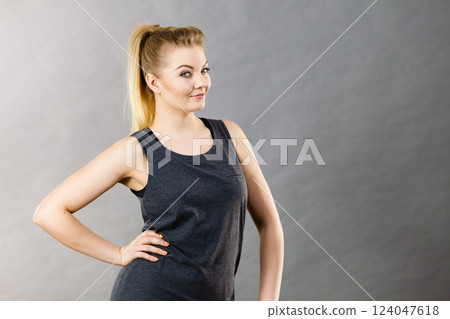 Happy woman wearing black tank top 124047618