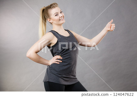 Happy woman wearing black tank top 124047622