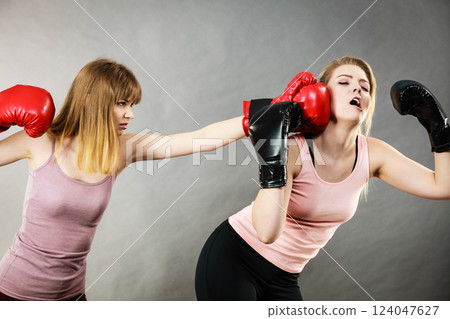 Agressive women fighting boxing with female 124047627