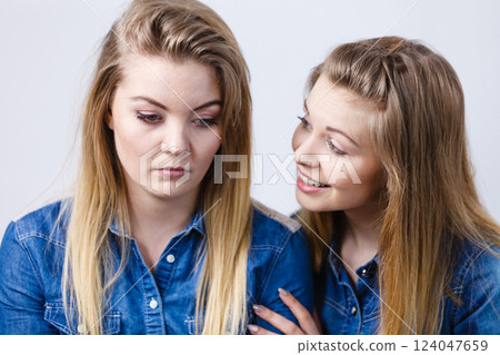 Woman being sad her friend comforting her Woman being sad her friend comforting her 124047659